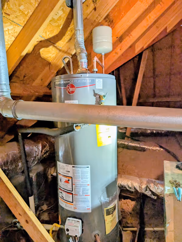 Rheem tank water heater installed in an attic