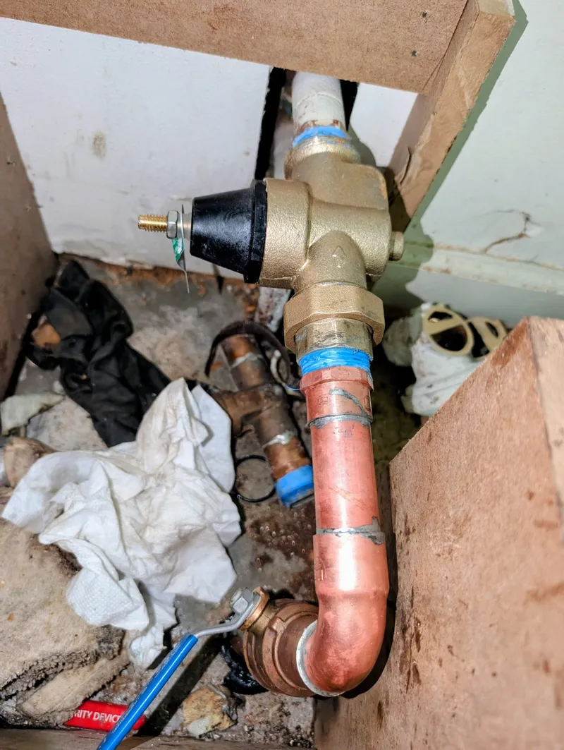 Water pressure regulator and shut-off valve replacement on Kanis corridor