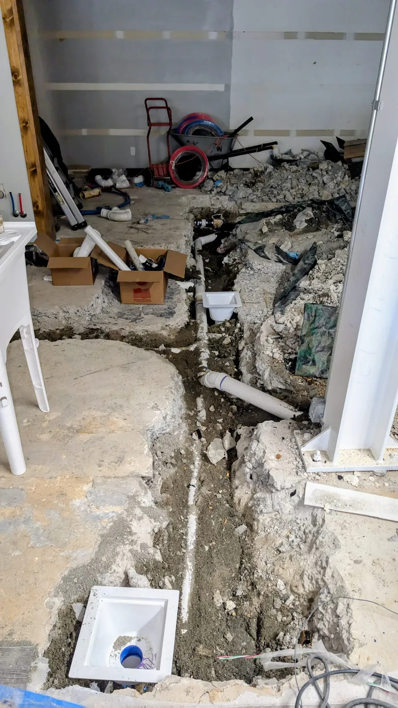 Concrete jackhammered throughout a commercial building near UALR to install new kitchen drain lines for a future restaurant