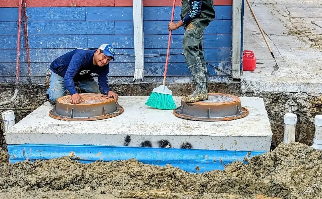 Diamond State Plumbing team after completing a grease trap installation