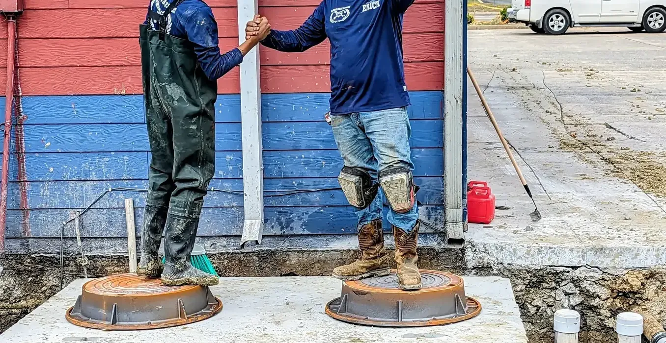 Diamond State Plumbing team after completing a grease trap installation