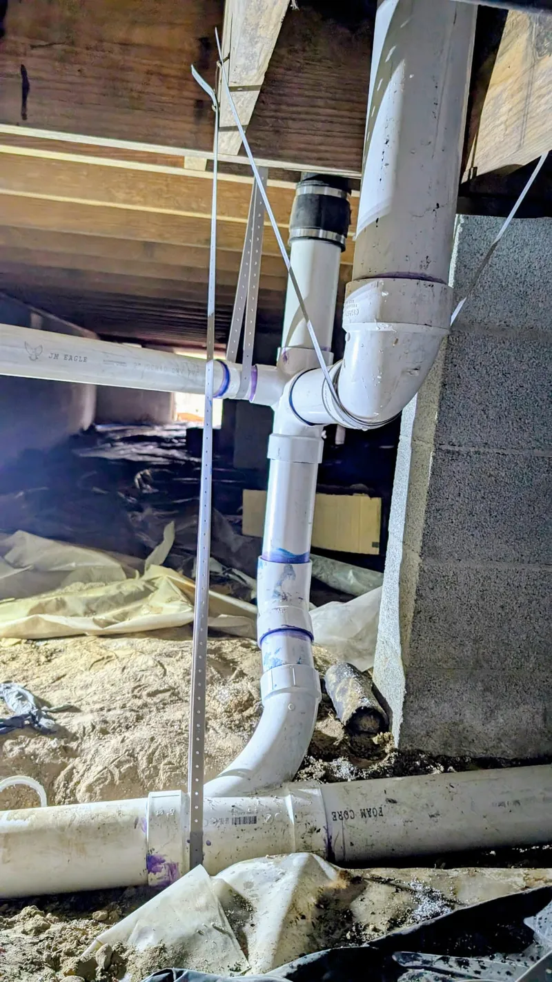 New drain lines installed to replace old rusted pipes in a Cammack Village home