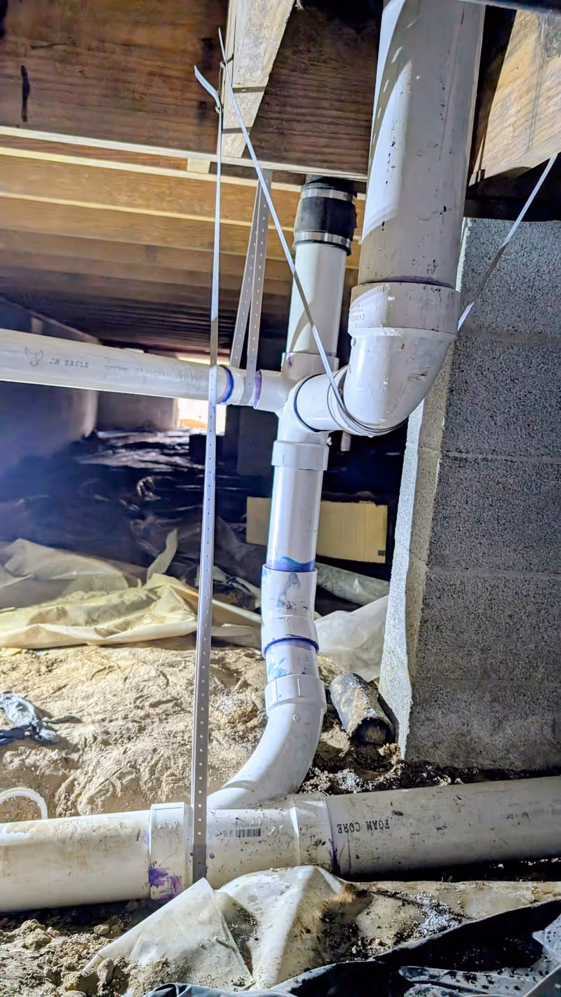 New drain lines installed to replace old rusted pipes in a Cammack Village home