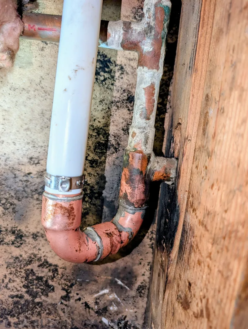 New PEX line rerouted above slab to bypass a leaking copper pipe buried in concrete