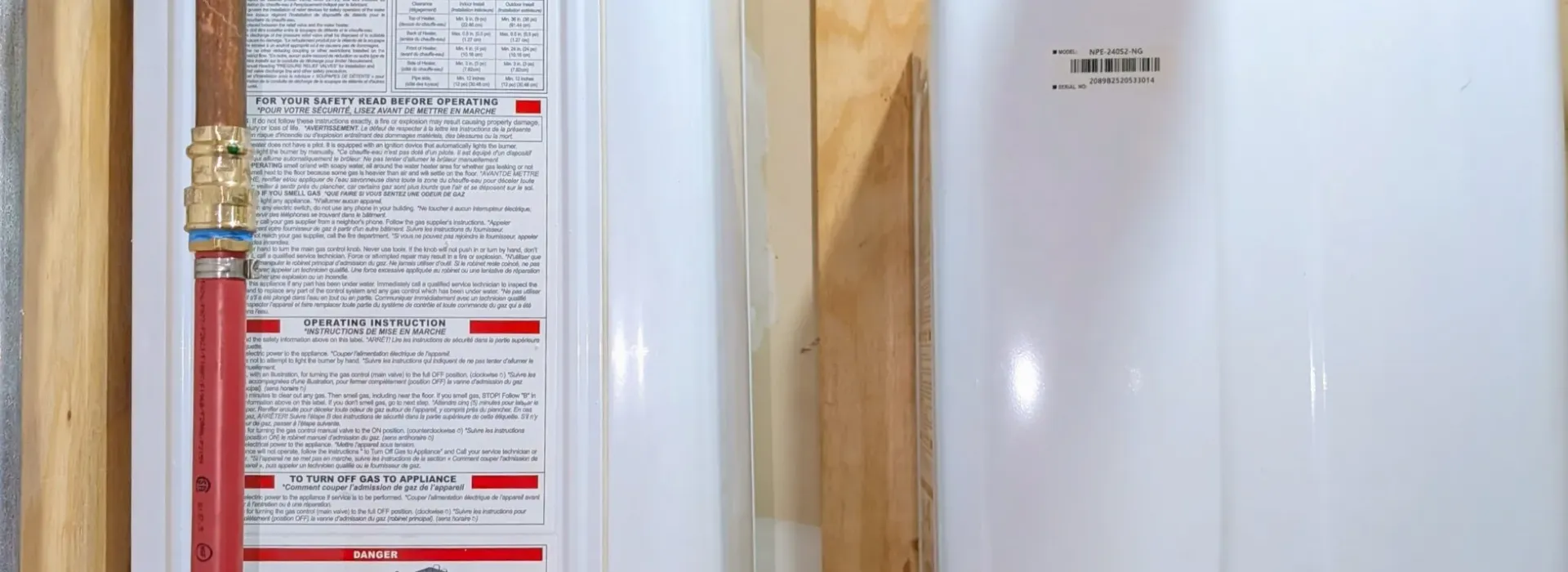 Stiebel Eltron point-of-use tankless water heater with insulated pipe connections mounted on a wall