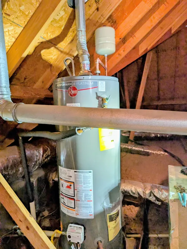 Rheem tank water heater installed in an attic